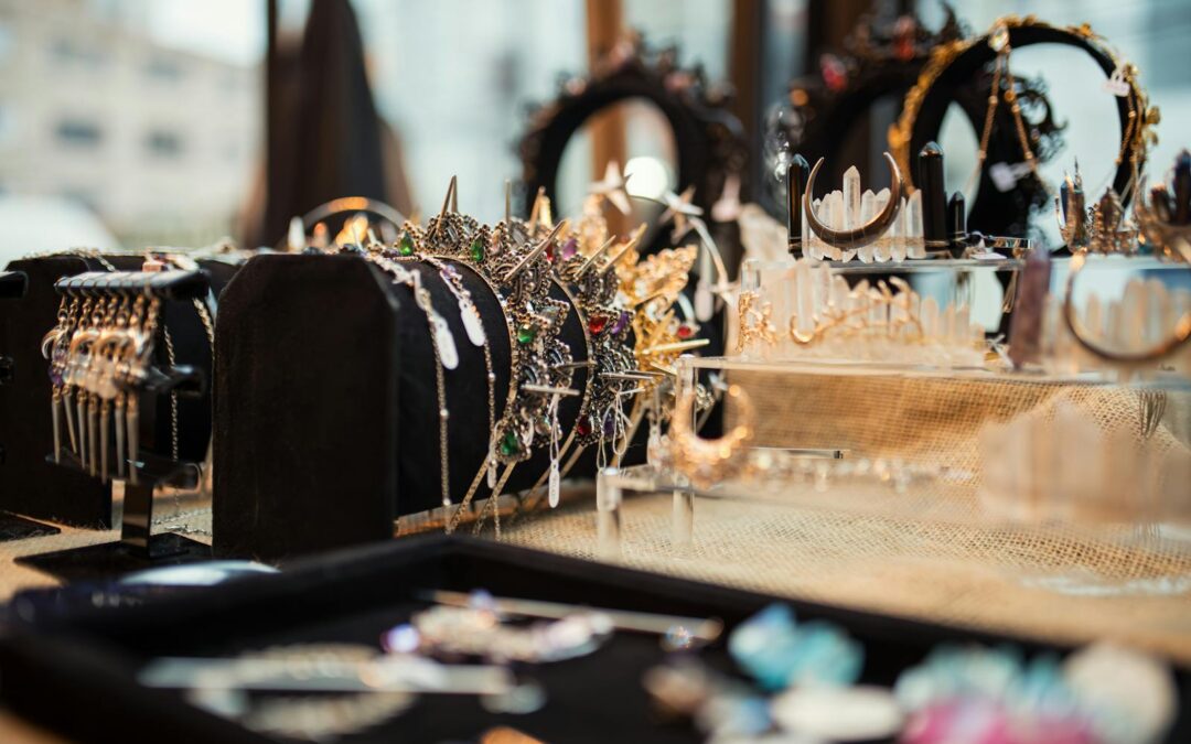 Close-up of exquisite jewelry display including necklaces and crowns, capturing elegance and glamour.